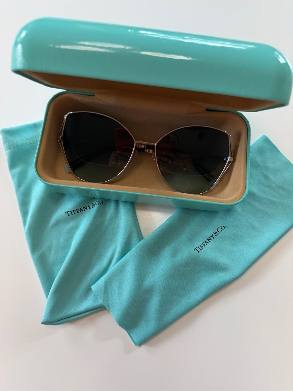 Tiffany & Co. cat eye Sunglasses w blue tint lenses and silver frame TF3072